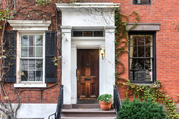 Classic Greek Revival Townhouse architecture in Greenwich Village in New York City.