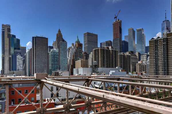 New York City skyline downtown in Manhattan from the Brooklyn Bridge.