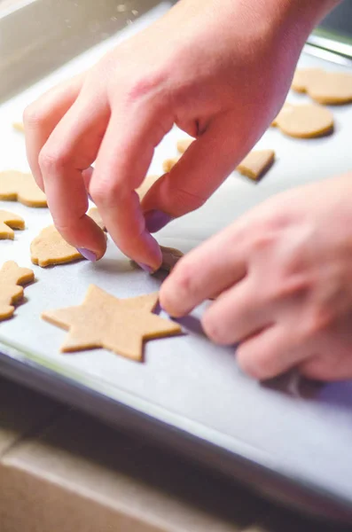 Abstract Christmas food background with cookies molds and flour. Baking Christmas cookies - table, cookie cutters and cookies. — Stock Photo, Image