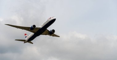 Heathrow, United Kingdom - August 03 2019:   British Airways Boeing 787 Dreamliner registration G-ZBKF, flight number BA281 departs Heathrow airport en route to Los Angeles seen from Myrtle Avenue