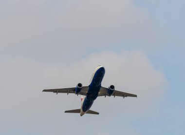 Heathrow, United Kingdom - August 03 2019:   British Airways Airbus A320-232 registration G-EUUR,  flight number BA1442 departs Heathrow airport en route to Edinburgh seen from Myrtle Avenue