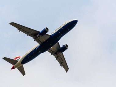 Heathrow, United Kingdom - August 03 2019:   British Airways Airbus A320-232 registration G-EUUR,  flight number BA1442 departs Heathrow airport en route to Edinburgh seen from Myrtle Avenue