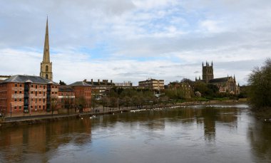 Worcester, United Kingdom - March 15 2020:  The view of houses ware houses and churches along the River Severn from Worcester Bridge clipart