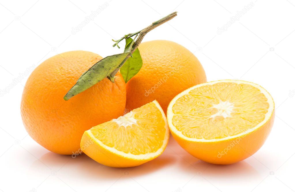 Oranges isolated on white background two whole with green leaf one half one sliced quarte