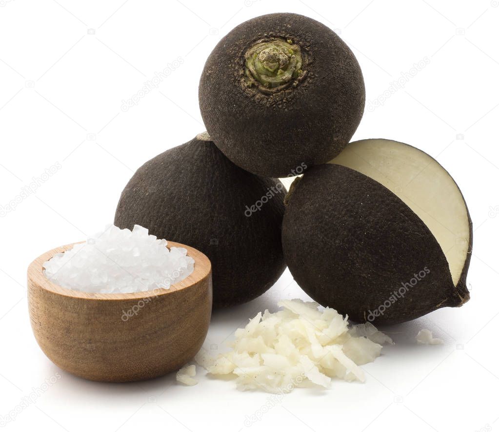 Black radish set three bulbs chopped stack and sea salt in a wooden bowl isolated on white backgroun