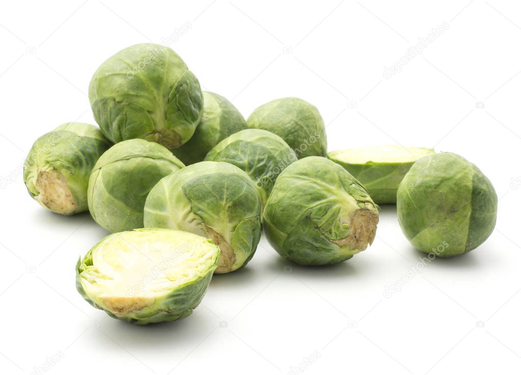 Raw Brussels sprout stack isolated on white background heads two sliced halve