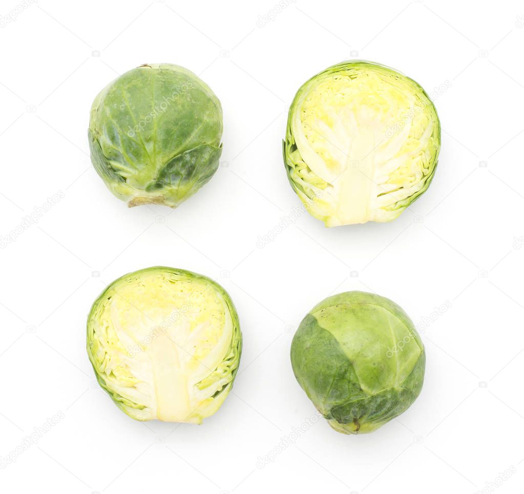 Brussels sprout two raw heads and two halves top view isolated on white backgroun