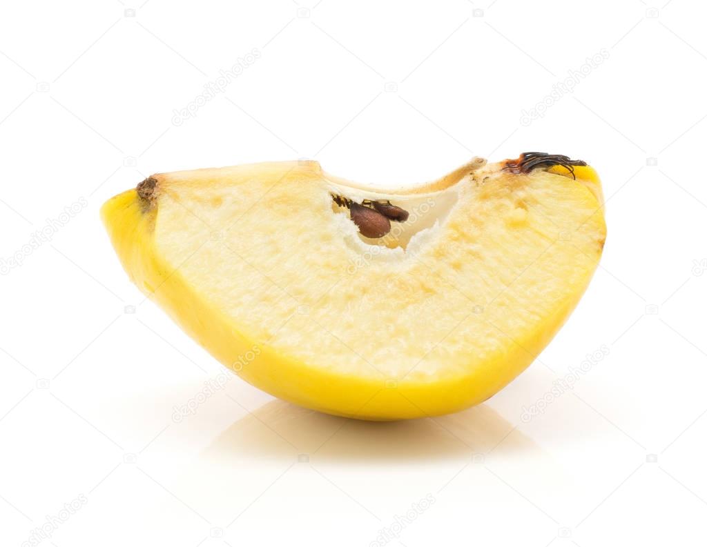 One yellow quince slice with seeds isolated on white background raw ripe