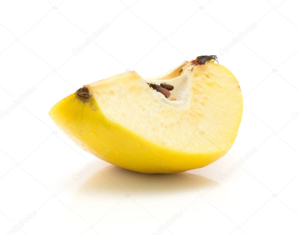 One yellow quince slice isolated on white background raw ripe