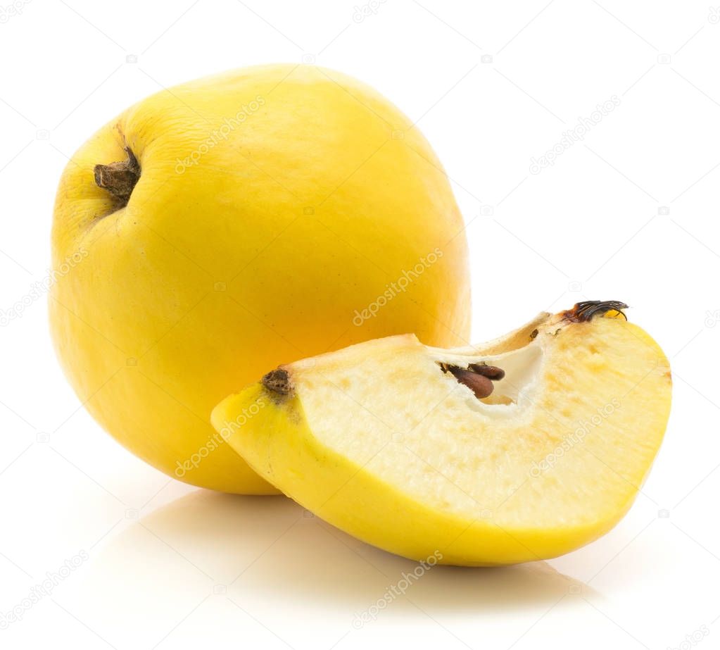 One yellow quince with a slice with seeds isolated on white background raw ripe