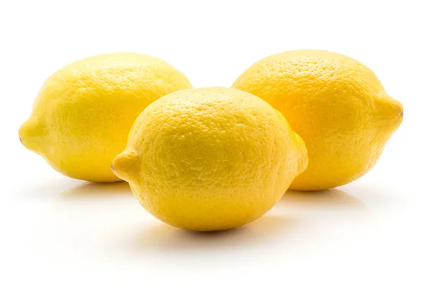 Tre Gula Citroner Isolerad Vita Bak — Stockfoto