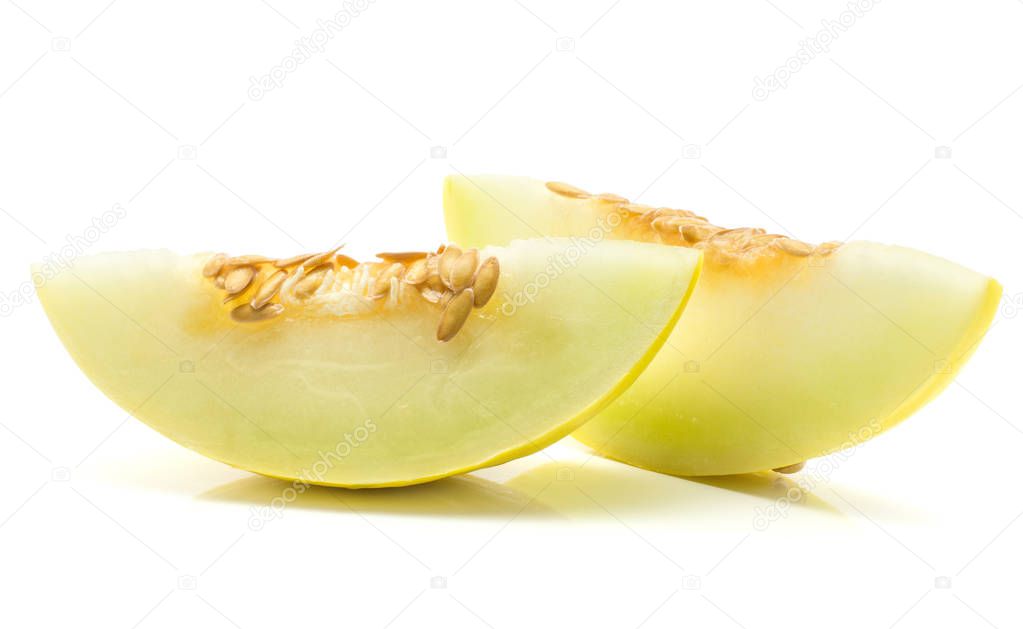 Yellow honeydew melon two slices with seeds isolated on white backgroun