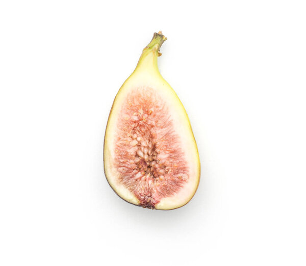 One fig sliced half with rose flesh isolated on white background top view ripe fresh purple gree