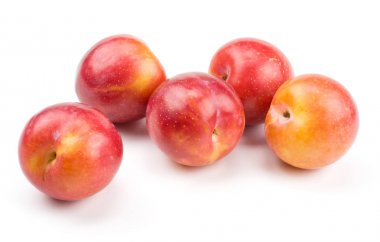 Five plums red orange isolated on white backgroun clipart