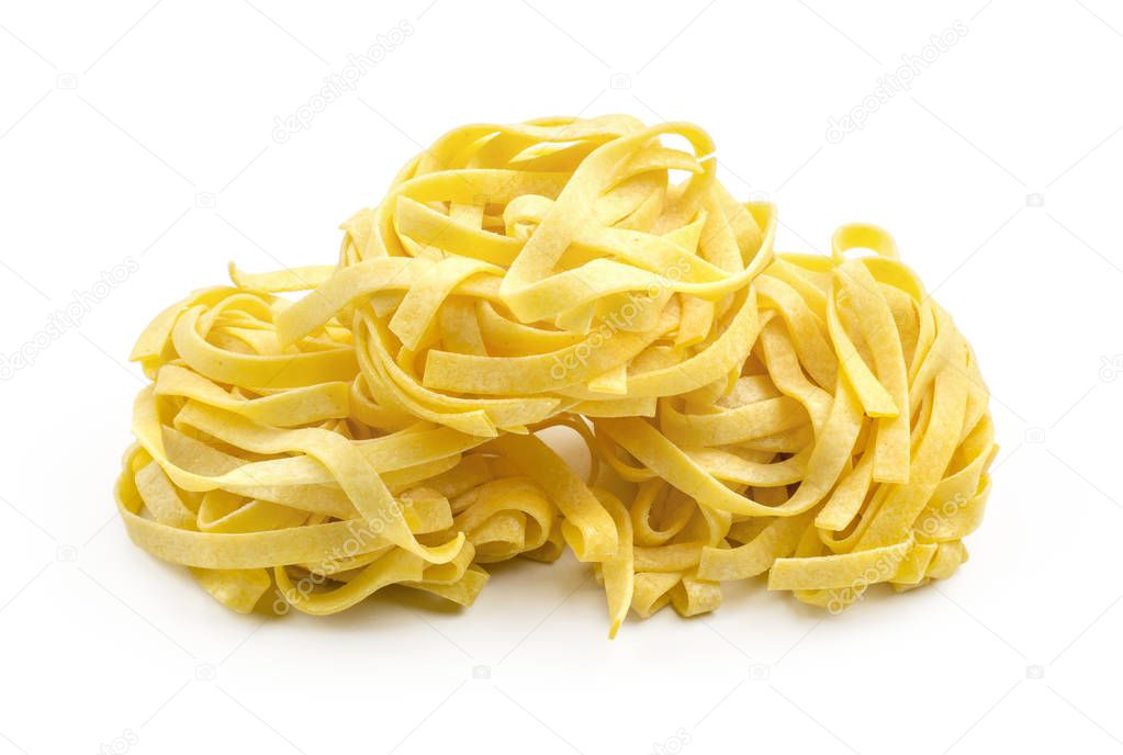 Fettuccine pasta classic raw isolated on white background three pieces