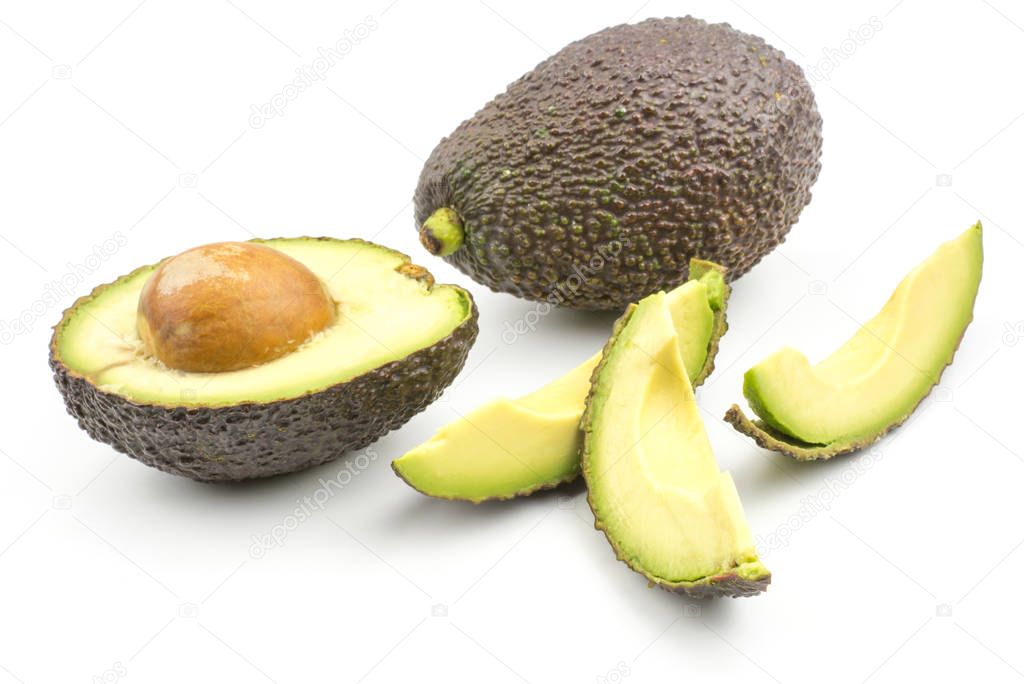 Avocado one half three slices isolated on white background ripe green brown alligator pear with a see