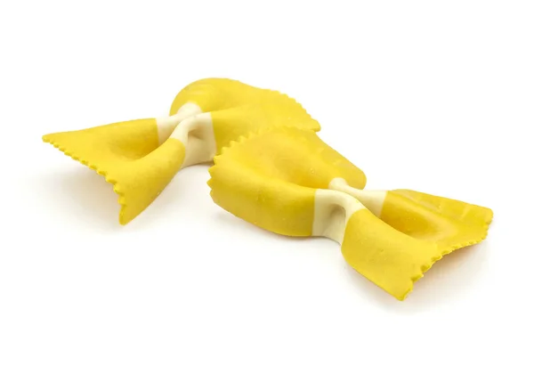 Farfalle Pasta Met Kurkuma Geïsoleerd Een Witte Achtergrond Twee Ruwe — Stockfoto