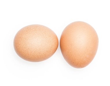 Beyaz arka plan üzerinde iki domesti izole kahverengi tavuk yumurta Üstten Görünüm