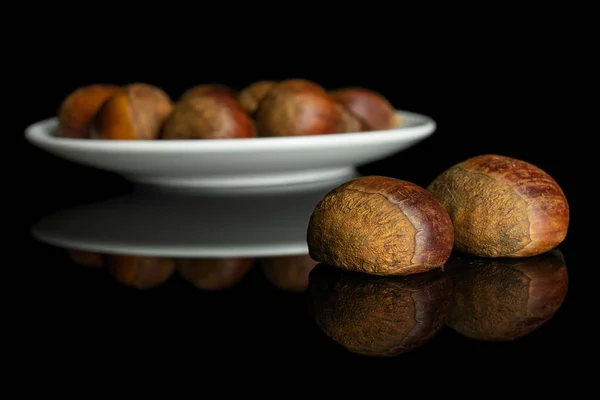 Castanha marrom doce isolado em vidro preto — Fotografia de Stock