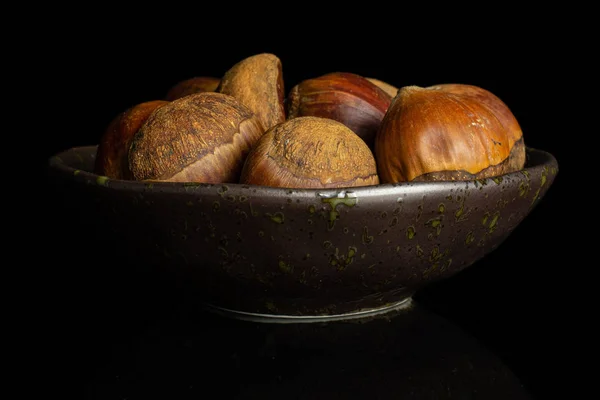 Castanha marrom doce isolado em vidro preto — Fotografia de Stock