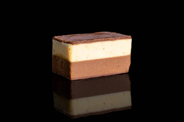 Chocolate praline candies isolated on black glass — Stock Photo, Image