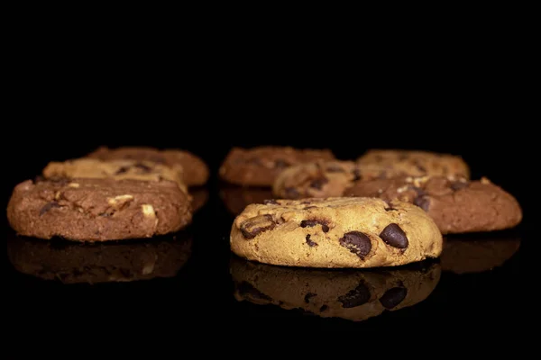 Sweet brown cookie isolated on black glass — Stock Photo, Image