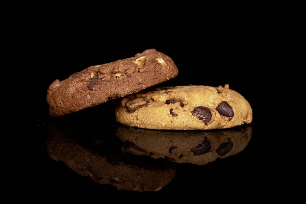 Sweet brown cookie isolated on black glass — Stock Photo, Image