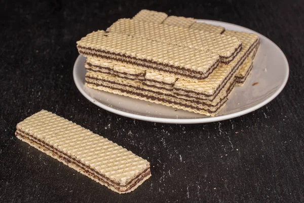 Chocolate biscuit wafer on grey stone