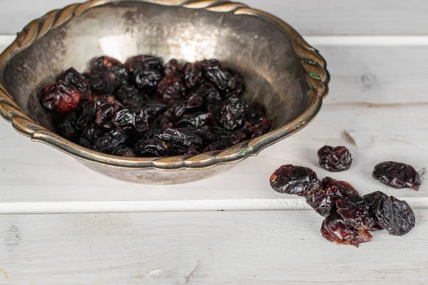 Dried cowberry on grey wood — Stock Photo, Image