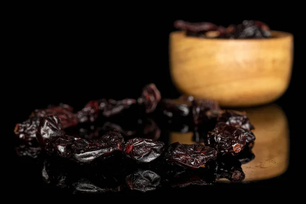 Dried cowberry isolated on black glass — Stock Photo, Image