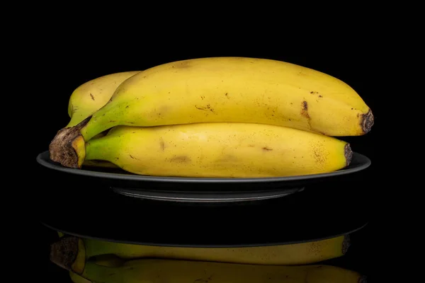 Banana amarela doce isolada em vidro preto — Fotografia de Stock