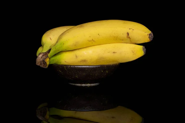Banana amarela doce isolada em vidro preto — Fotografia de Stock