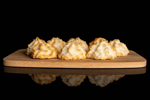 Plain coconut biscuit isolated on black glass — Stock Photo, Image