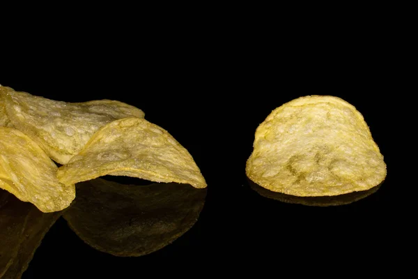 Crisp potato chip isolated on black glass — Stock Photo, Image