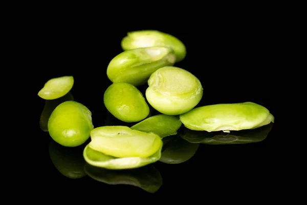 Fresh snap bean isolated on black glass