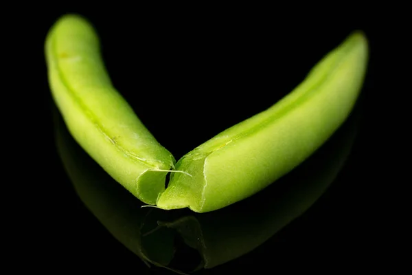 Fresh snap bean isolated on black glass