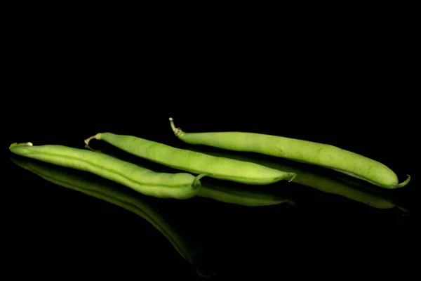 Fresh snap bean isolated on black glass — Stock Photo, Image