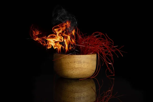 Chili pepper threads isolated on black glass — 스톡 사진