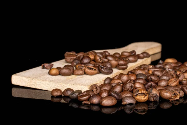 Fresh coffee bean isolated on black glass — 스톡 사진