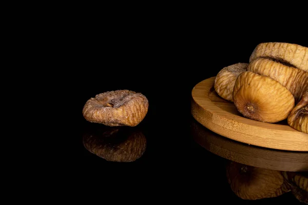Dried fig fruit isolated on black glass — 스톡 사진