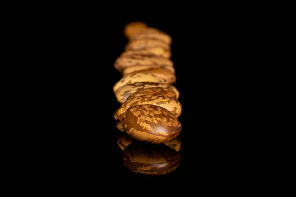 Pinto brown bean isolated on black glass — Stock Photo, Image