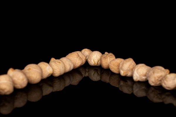 Fresh tan chickpea isolated on black glass — 스톡 사진