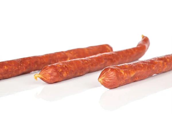 Smoked spicy sausage isolated on white — 스톡 사진