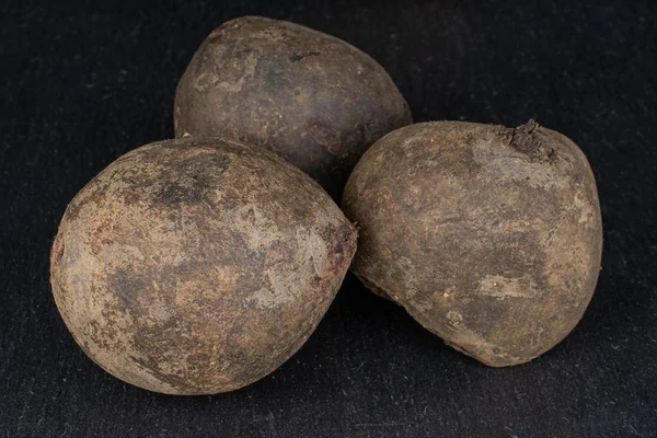 Raw sweet beetroot on grey stone