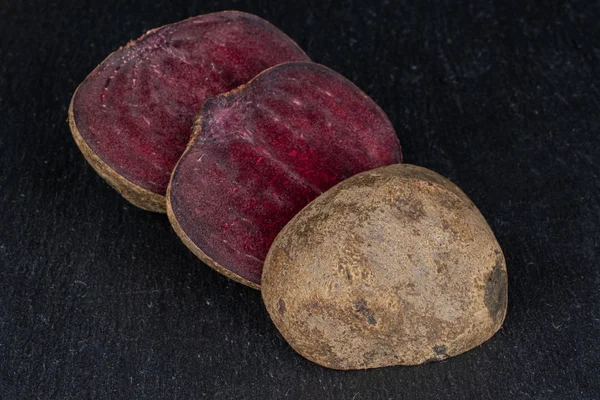 Raw sweet beetroot on grey stone