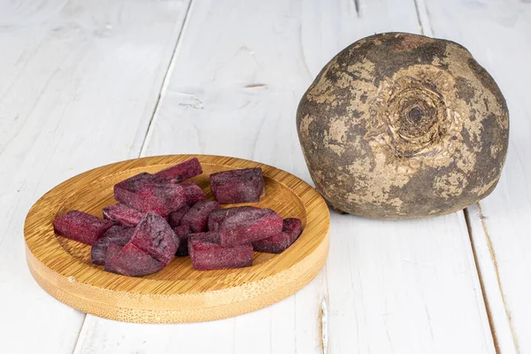 Raw sweet beetroot on grey wood