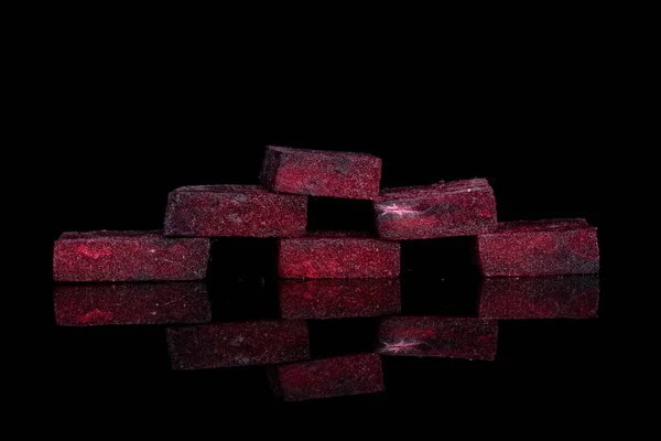 Raw sweet beetroot isolated on black glass