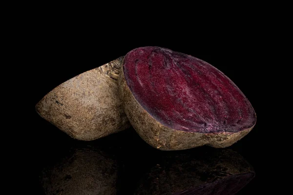 Raw sweet beetroot isolated on black glass