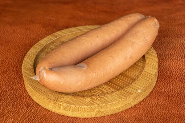 German pork sausage on cognac leather — 스톡 사진