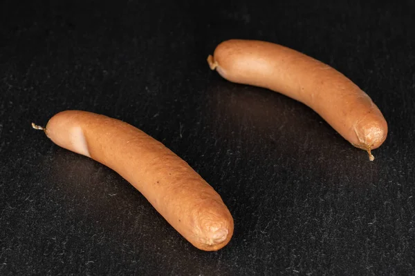 German pork sausage on grey stone — Stock Photo, Image